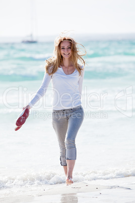 beautiful young woman relaxing at beach in summer