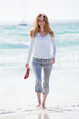 beautiful young woman relaxing at beach in summer