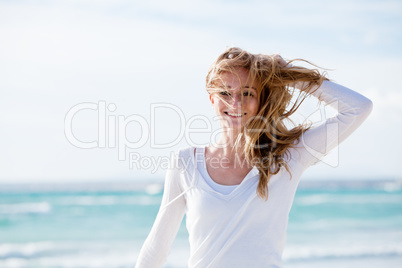 beautiful young woman relaxing at beach in summer