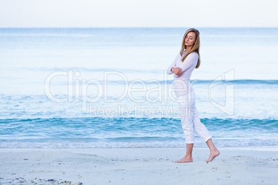 attractive young blonde woman relaxing on the beach
