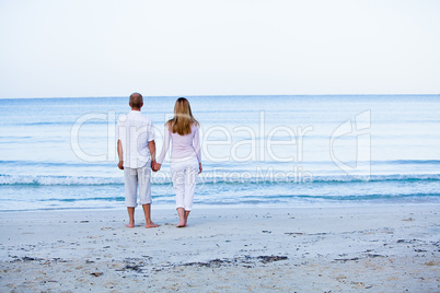 happy couple in love having fun on the beach