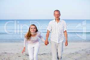 happy couple in love having fun on the beach