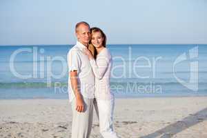 happy couple in love having fun on the beach