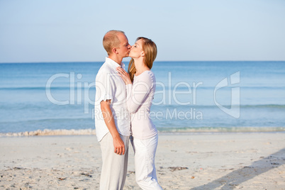 happy couple in love having fun on the beach