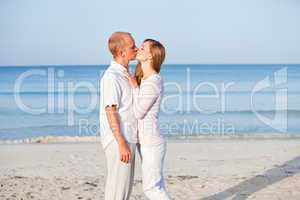 happy couple in love having fun on the beach