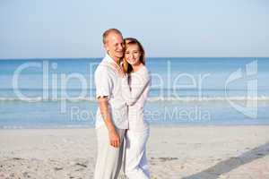 happy couple in love having fun on the beach