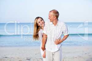 happy couple in love having fun on the beach