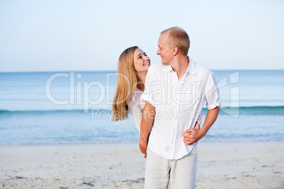 happy couple in love having fun on the beach