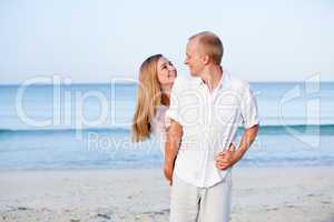 happy couple in love having fun on the beach