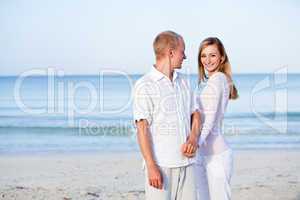 happy couple in love having fun on the beach