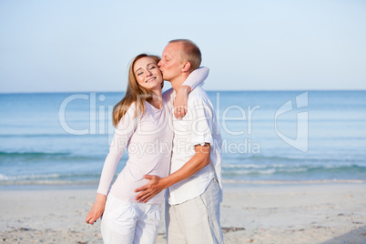 happy couple in love having fun on the beach