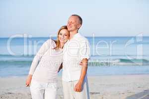 happy couple in love having fun on the beach