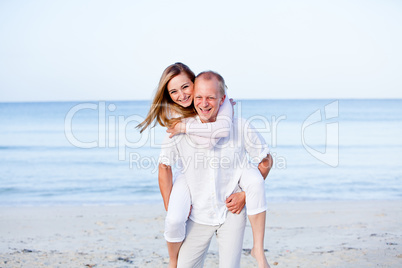 happy couple in love having fun on the beach