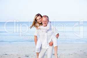 happy couple in love having fun on the beach