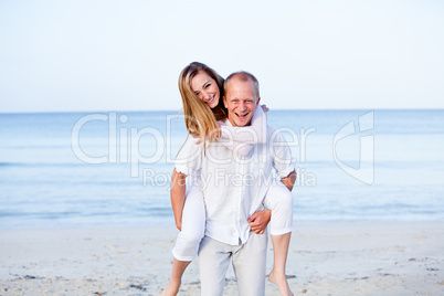 happy couple in love having fun on the beach