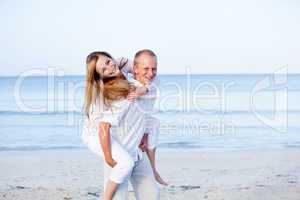 happy couple in love having fun on the beach