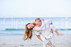 happy couple in love having fun on the beach