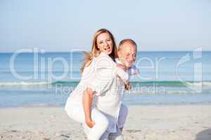 happy couple in love having fun on the beach