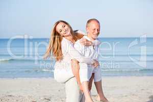 happy couple in love having fun on the beach