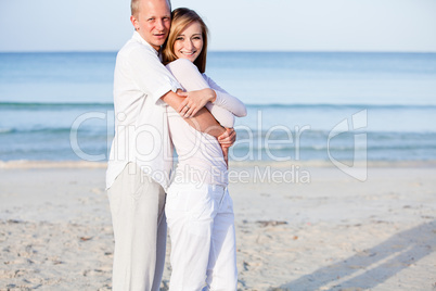 happy couple in love having fun on the beach