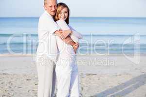 happy couple in love having fun on the beach