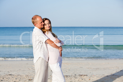 happy couple in love having fun on the beach