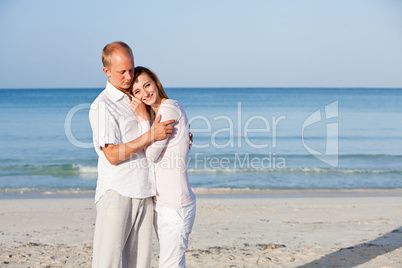 happy couple in love having fun on the beach