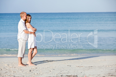 happy couple in love having fun on the beach