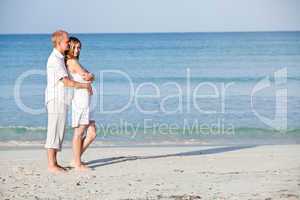 happy couple in love having fun on the beach