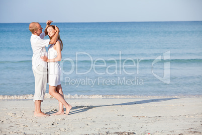 happy couple in love having fun on the beach