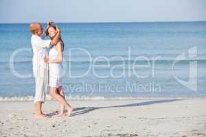 happy couple in love having fun on the beach