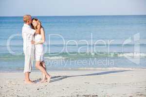 happy couple in love having fun on the beach