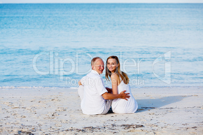 happy couple in love having fun on the beach