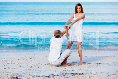 happy couple in love having fun on the beach happy couple in love having fun on the beach