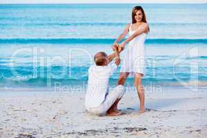 happy couple in love having fun on the beach