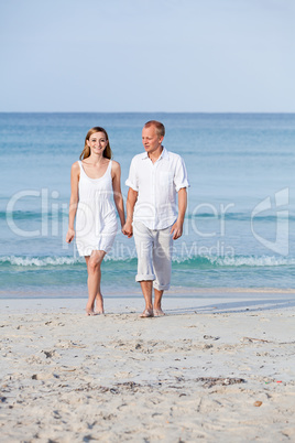 happy couple in love having fun on the beach