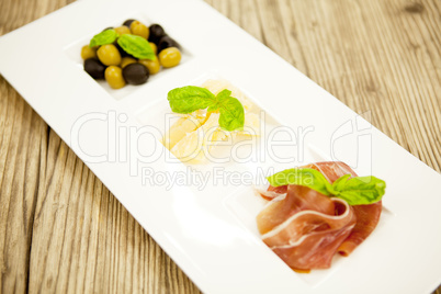 deliscious antipasti plate with parma parmesan olives