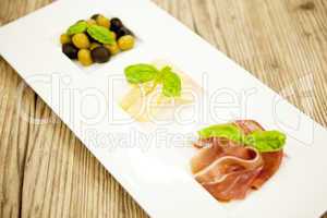 deliscious antipasti plate with parma parmesan olives