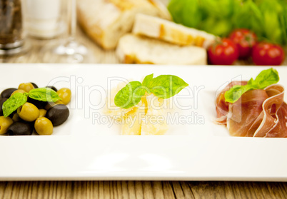 deliscious antipasti plate with parma parmesan olives