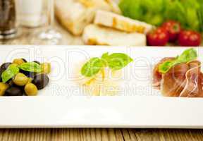 deliscious antipasti plate with parma parmesan olives