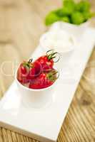 tasty tomatoes mazarella and basil on plate on table