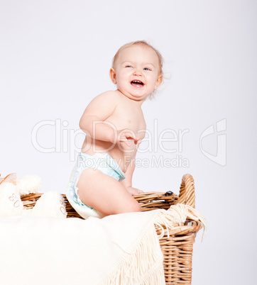 cute little baby infant in basket with teddy