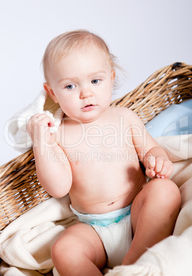 cute little baby infant in basket with teddy