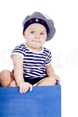 cute little baby in sailor fashion playing