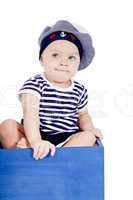 cute little baby in sailor fashion playing