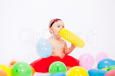 cute little baby child with colorfull balloons birthday