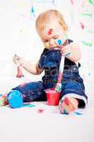 cute little baby painting and splatter with colours