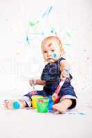 cute little baby painting and splatter with colours