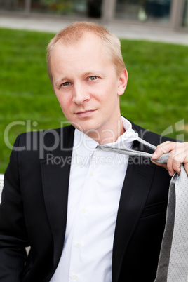 business man with black suit and tie outdoor