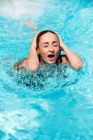 beautiful woman in summer in pool swimming